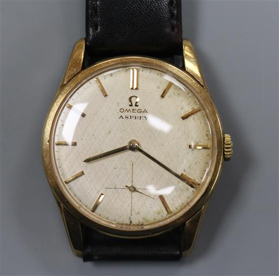 A gentlemans 1960s 9ct gold Omega manual wind wrist watch, movement c.269, retailed by Asprey,